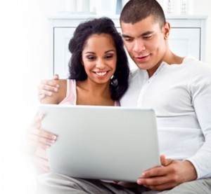 Happy Couple looking at a computer